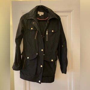 Michael Michael kors brand black rain coat with hood. Size small.